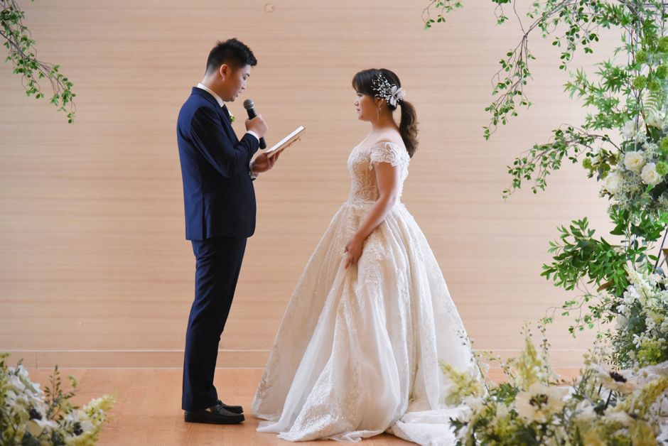 Couple reciting vows during wedding ceremony